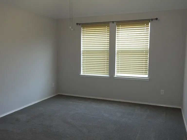 Bedroom #3 with ceiling fan.