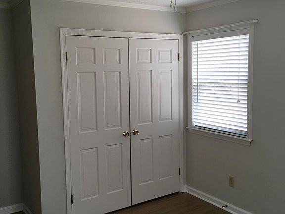 This is the 3rd bedroom located on the SE corner of the living area of house. View is looking NE toward the closet double door.