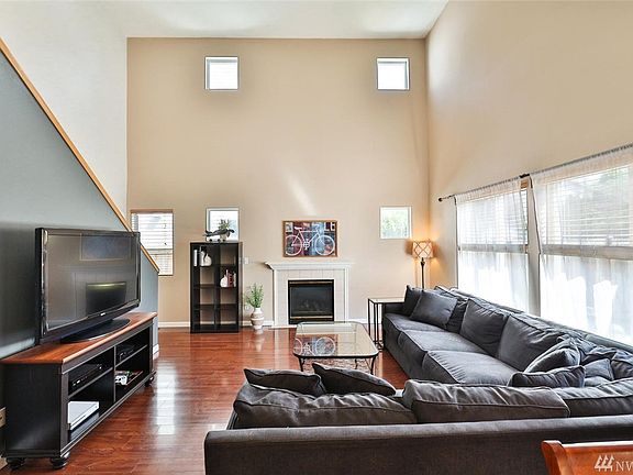 Vaulted ceilings fill the family room with light.