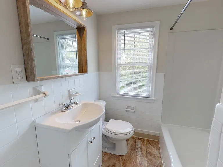 Modern, bright renovated bath with designer touches.