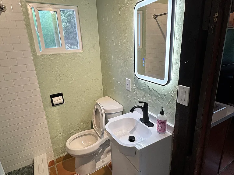 Dimmable lighted mirror with defroster. New toilet with dedicated GFCI bidet outlet, new sink vanity, new plumbing, and all new fixtures.
