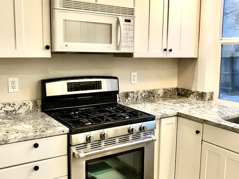 kitchen with granite counters and Jenn-Air stove