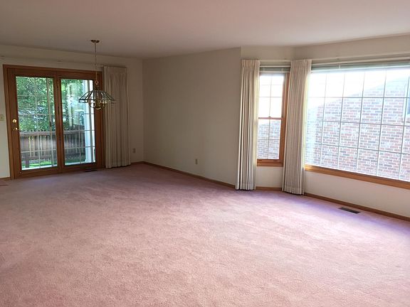 Dining room and living room with access to the back patio