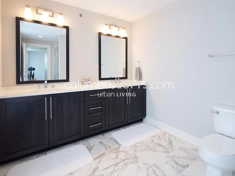 master bathroom has oversized custom walk-in shower and large double vanity