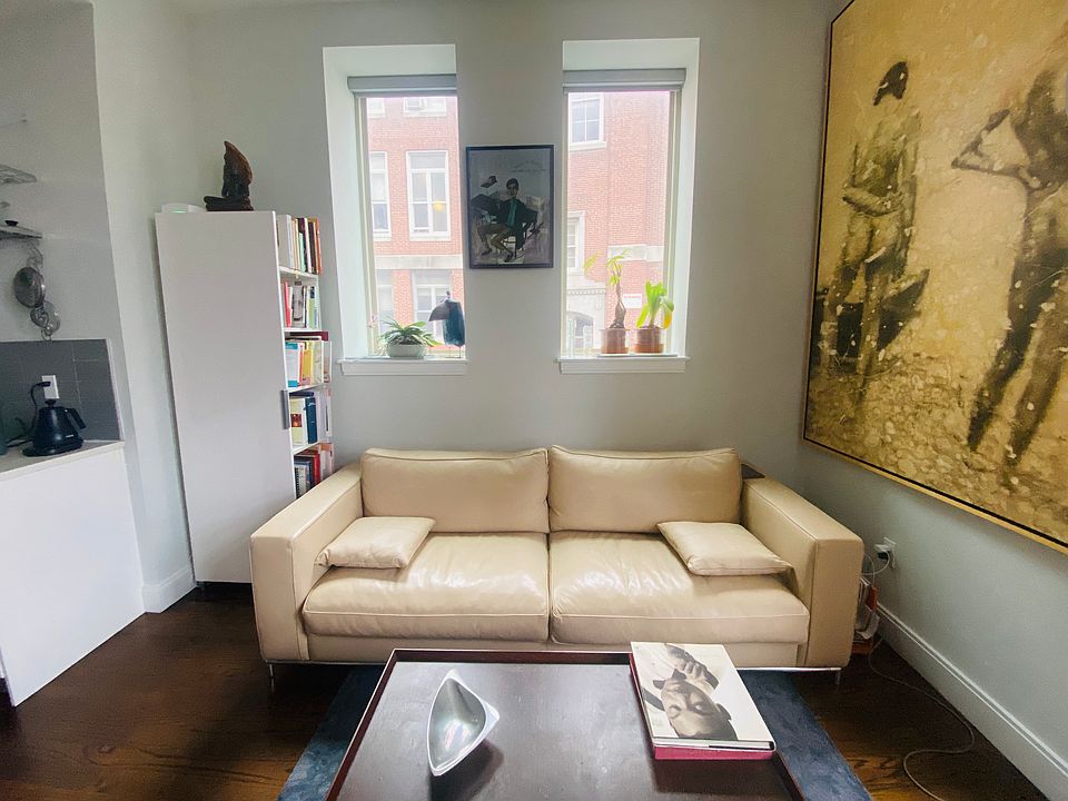 1st Floor entrance featuring two window and couch area