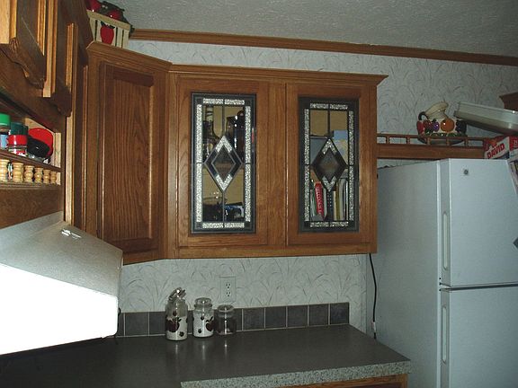 Extra touches such as display cabinets and a built in spice rack