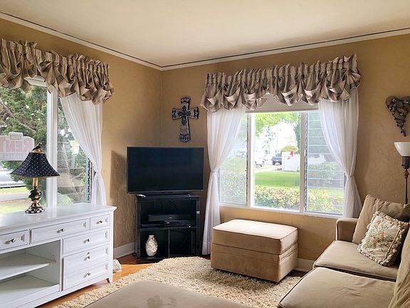 Living room w/ lots of light, pretty courtyard views.