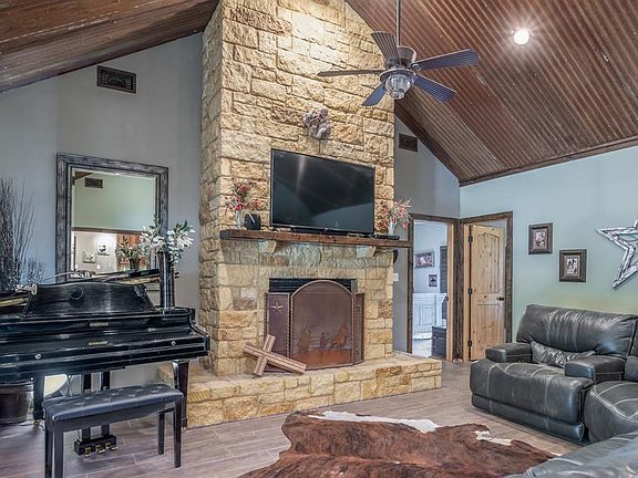 The stunning feature wood-burning Fireplace with oak mantle and entertainment wiring.