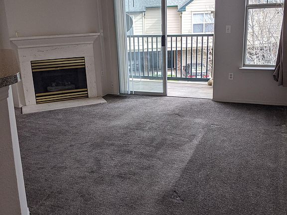 Living room with balcony, gas fireplace