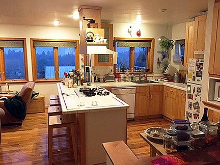 Kitchen, small dining table under windows.