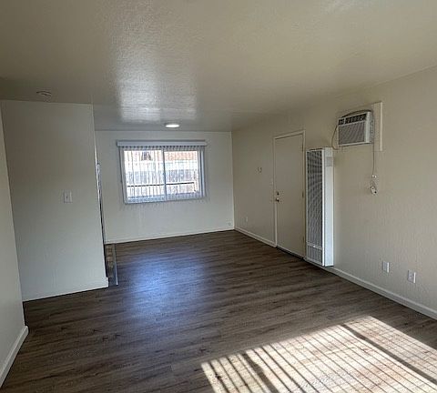 LIVING ROOM GOING INTO DINNING ROOM AND KITCHEN
