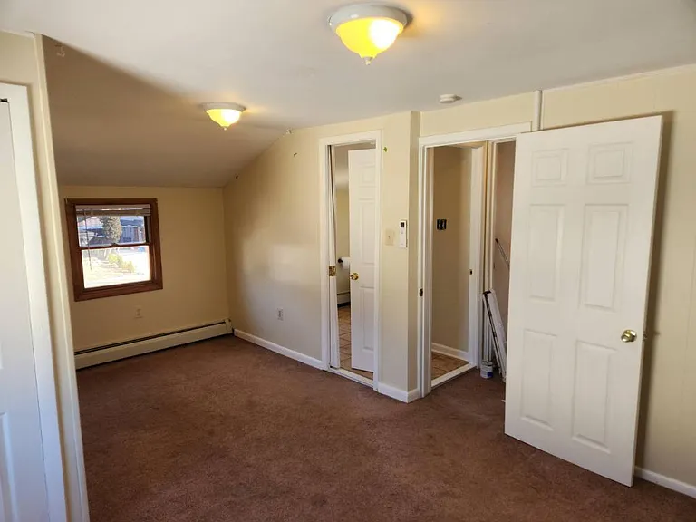 1 of 2 Second floor bedrooms with cali door to second floor bathroom