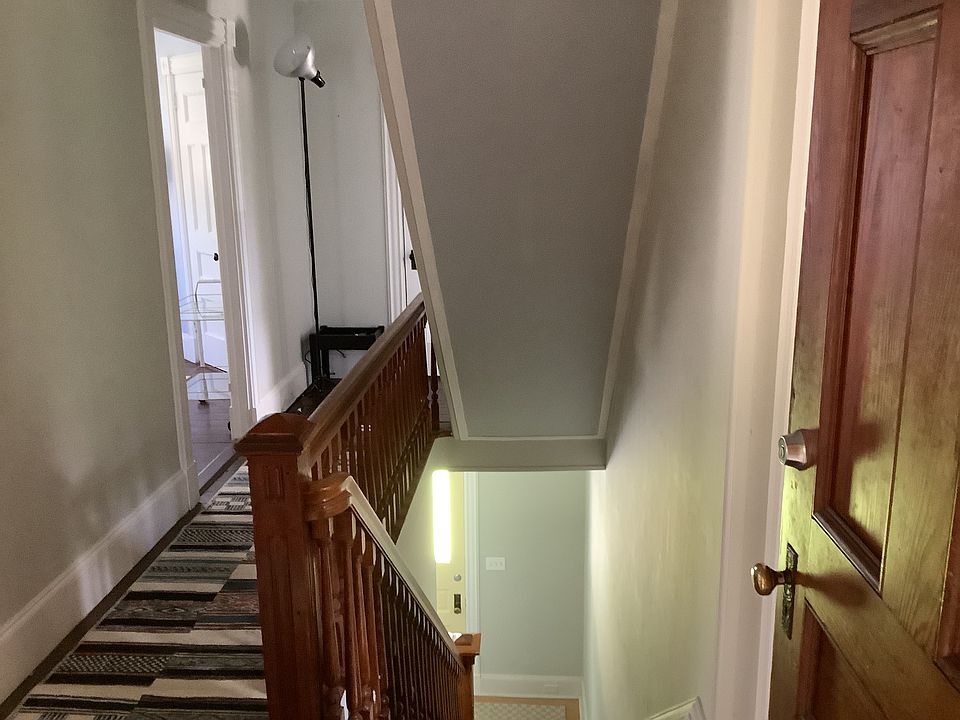 Back entry, with stair hall to front entry.