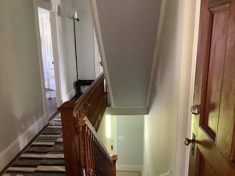 Back entry, with stair hall to front entry.