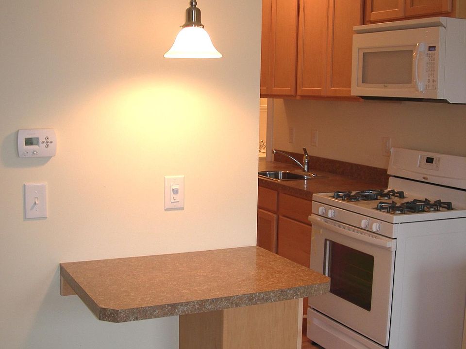 Breakfast bar looking into open floorplan kitchen