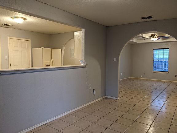 Dining to Living Room with Pass-Through/Breakfast Bar into Kitchen