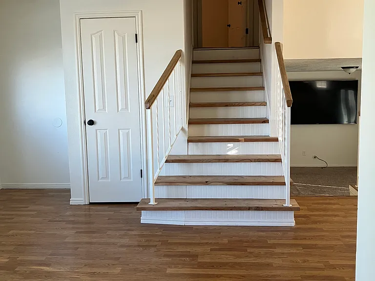 Staircase to upstairs bedrooms and full bath