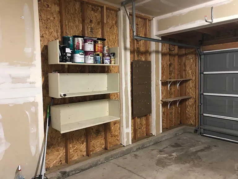 2-car garage with wall shelves