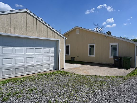 Back of the house and two car garage.
