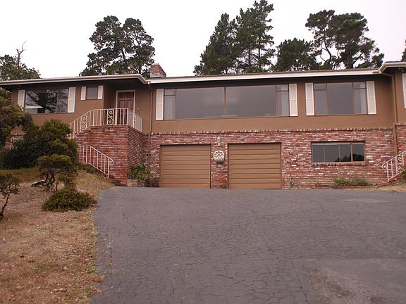 Front of house before new concrete driveway installed.