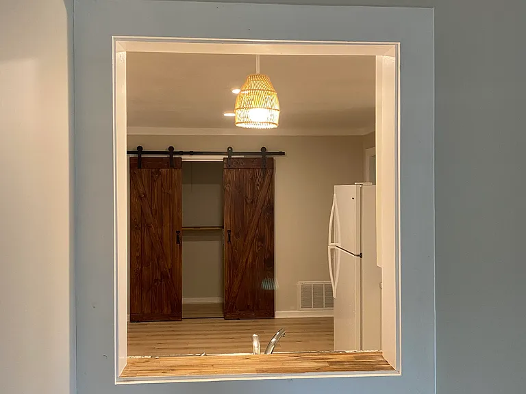 VIEW FROM GREAT ROOM INTO KITCHEN AND LAUNDRY