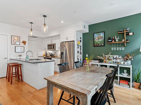 Open concept kitchen, dining and living