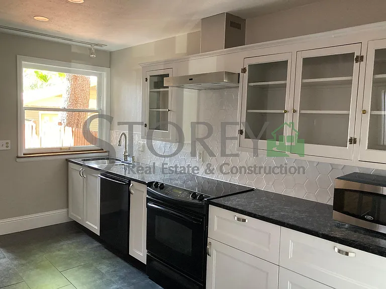 Stainless steel sink and glass-front cabinets