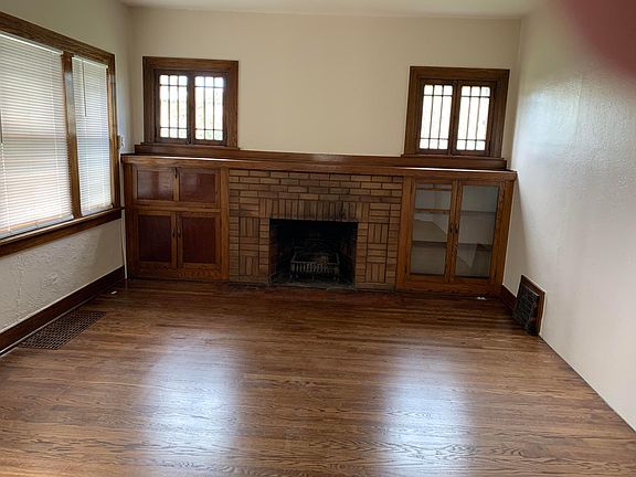 Living room with built in cabinet. (fireplace is non-operational)