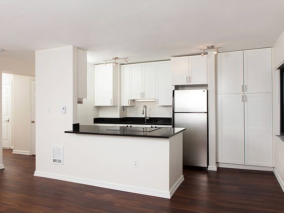 Open concept kitchen including breakfast bar