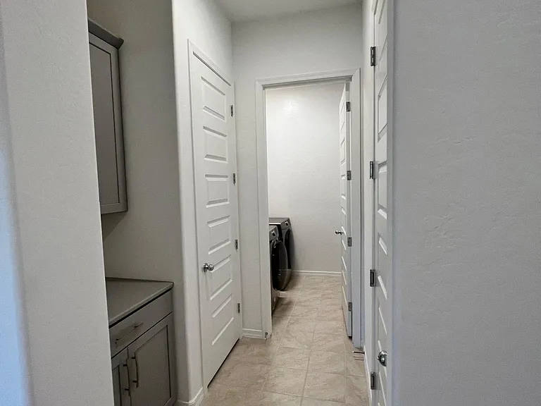 Mudroom at front and Laundry at back