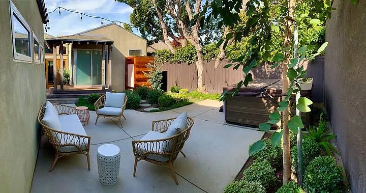Private Backyard: seating area, outdoor shower in the rear, 7 person hot tub on the right