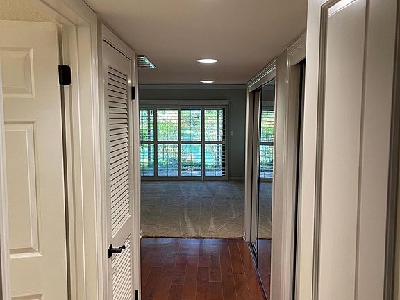Main bedroom hallway. Closet space on both sides.