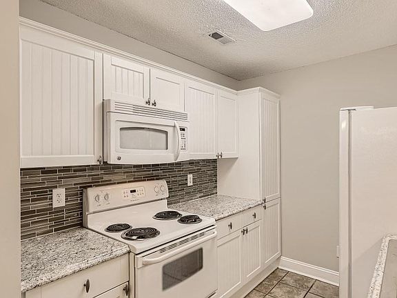 White beadboard cabinetry. Light, bright and cheery!