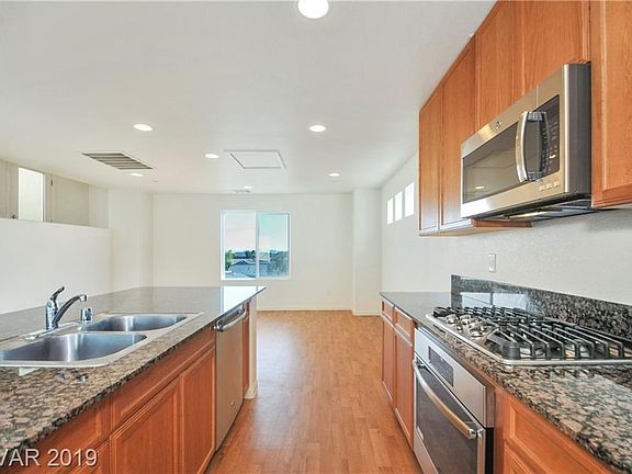 Enjoy this upgraded kitchen with its stainless steel appliances and granite counter tops.