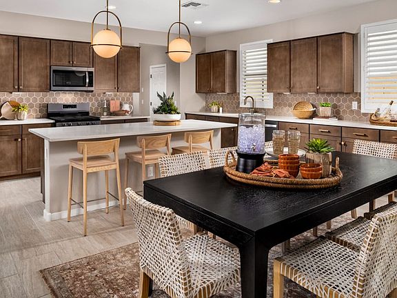 An image of the dining and kitchen in the Azure Model Home.
