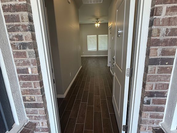 Open front door to see beautiful "hardwood" tile throughout