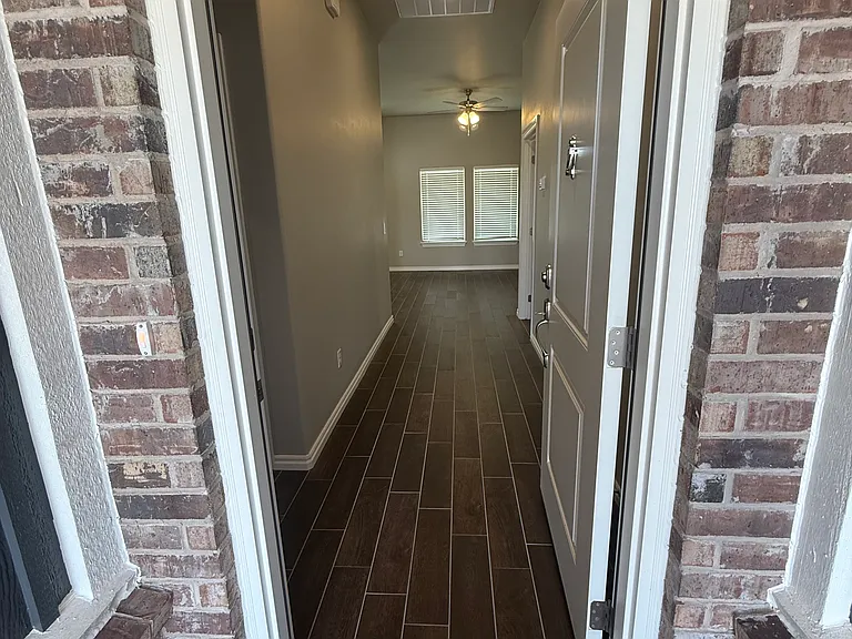 Open front door to see beautiful "hardwood" tile throughout