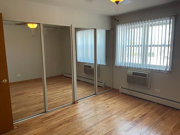 Bedroom with two sliding door closets. Also has new sleeve air conditioner.