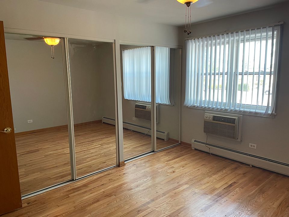 Bedroom with two sliding door closets. Also has new sleeve air conditioner.