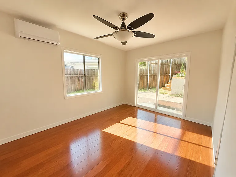 Second Bedroom (or office) with backyard access, closet, ceiling fan and mini split AC system