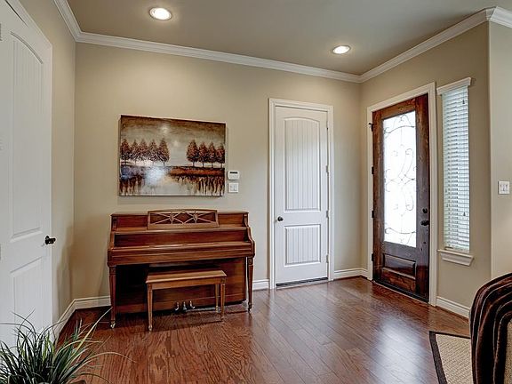 The home has rich hardwood floors, crown molding, recessed lighting and huge walk in closet at the entry. The garage is wired for an electric car with a special outlet and has a painted floor.