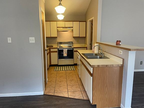 Kitchen. Walk-in Laundry room with plenty of storage and full size hook-ups is off the kitchen. You can see the doorway on the right.