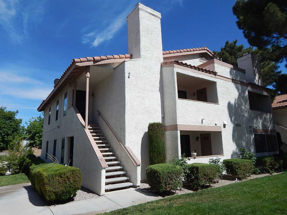 Exterior view of the 4 unit building showing the stairs leading up to the available upstairs rental unit
