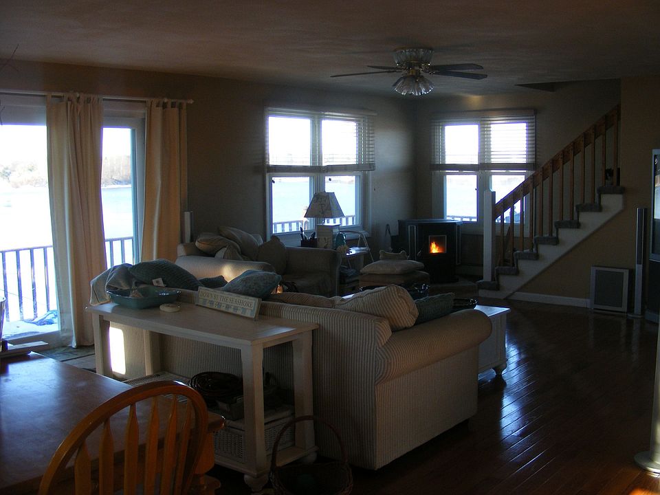 Open floor plan all windows look out to Potter Pond