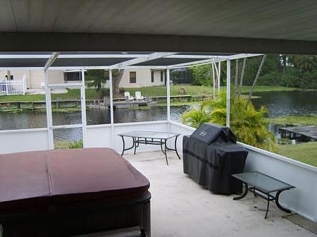 Relax on your screened in back porch, BBQ and enjoy the water!