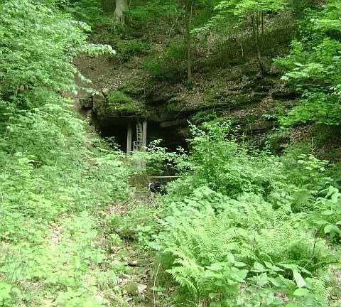 The cave which is the source of both homes' spring water