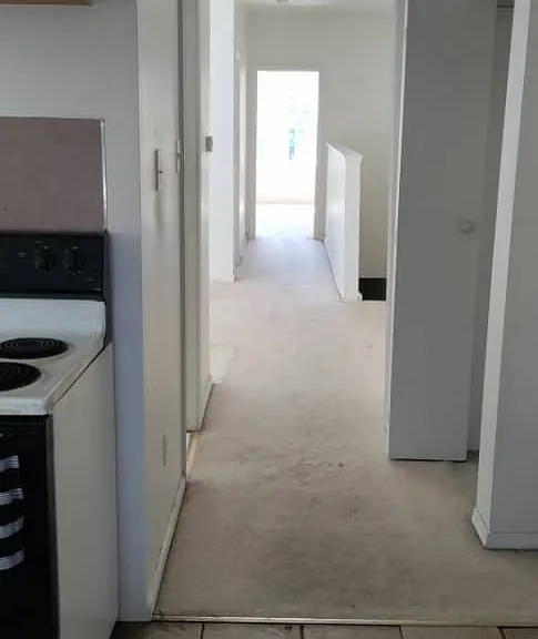 kitchen floor tile has been replaced with hardwood flooring. see video