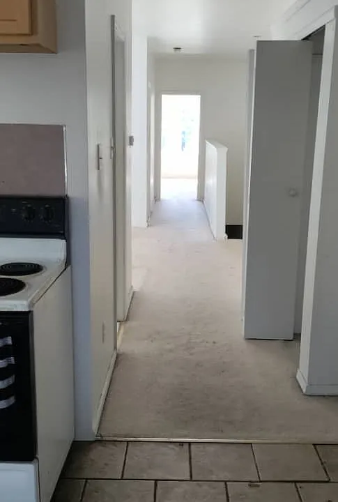 kitchen floor tile has been replaced with hardwood flooring. see video