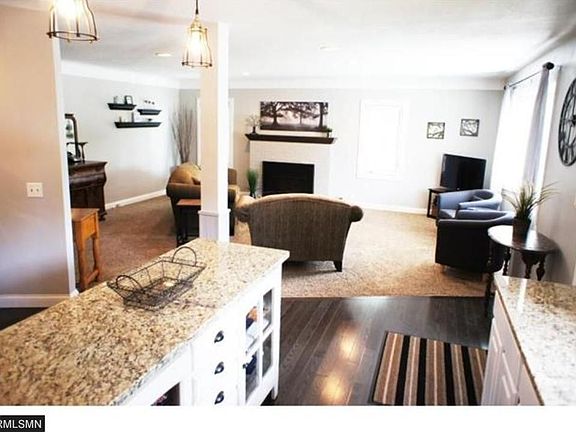 The Living Room features new carpeting and and open concept to the kitchen.