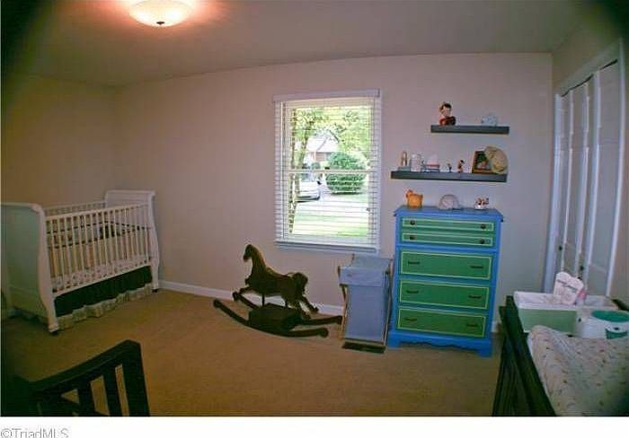 The expansive bedroom offers great light and space.